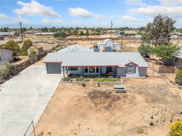14060 Osage Rd, Apple Valley, CA 92307 - view of front facade featuring an attached garage, fence, and driveway