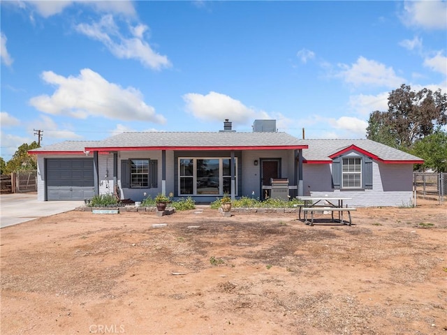 14060 Osage Rd, Apple Valley, CA 92307 - ranch-style home featuring a garage, fence, covered porch, and concrete driveway