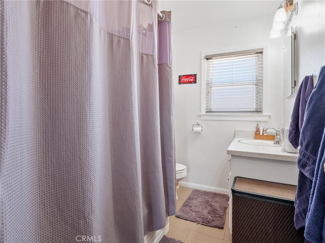 14060 Osage Rd, Apple Valley, CA 92307 - full bath with toilet, vanity, baseboards, and a shower with shower curtain
