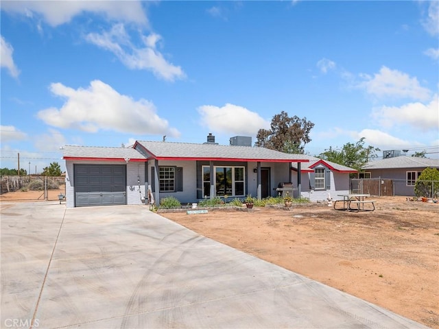 14060 Osage Rd, Apple Valley, CA 92307 - ranch-style house featuring a garage, fence, driveway, a chimney, and central air condition unit