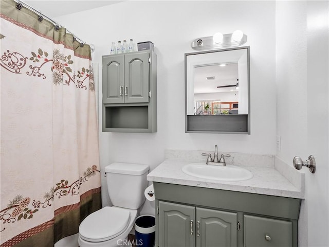 14060 Osage Rd, Apple Valley, CA 92307 - full bathroom with toilet, vanity, and curtained shower