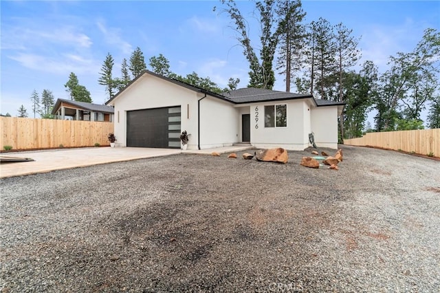 6296 Diamond Ave, Paradise, CA 95969 - view of front of house with driveway, stucco siding, a garage, and fence