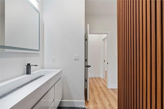6296 Diamond Ave, Paradise, CA 95969 - bathroom with wood finished floors, vanity, and baseboards