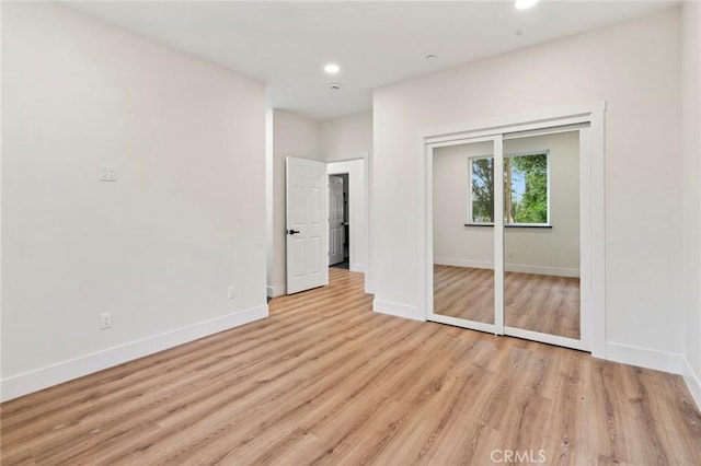 6296 Diamond Ave, Paradise, CA 95969 - unfurnished bedroom with baseboards, light wood-type flooring, recessed lighting, and a closet