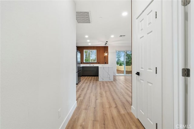 6296 Diamond Ave, Paradise, CA 95969 - hallway with recessed lighting, light wood-style flooring, a sink, and baseboards