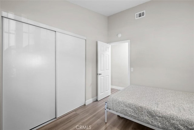 19018 Tule Way, Lake Elsinore, CA 92530 - bedroom with wood finished floors, a closet, and baseboards