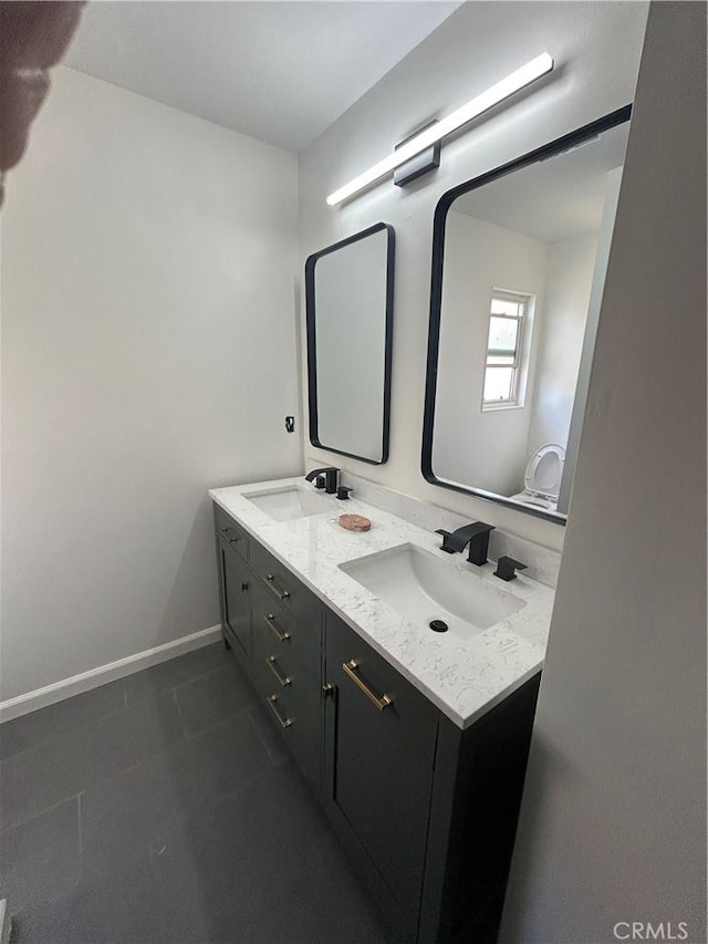 990 244th St, Harbor City, CA 90710 - full bath with double vanity, baseboards, and tile patterned floors