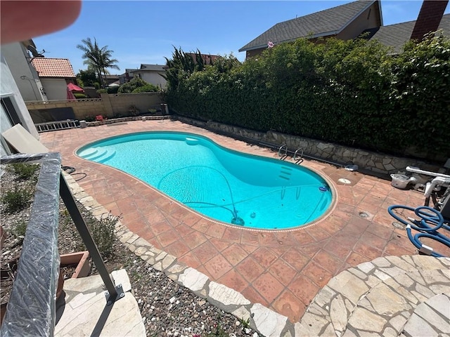 990 244th St, Harbor City, CA 90710 - view of swimming pool featuring a patio area and a fenced backyard