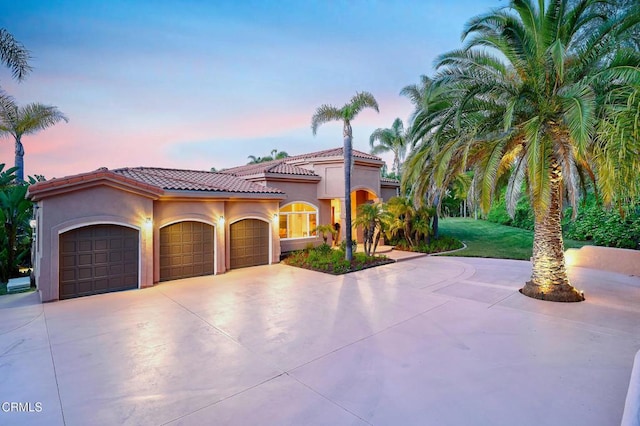 1690 Calle Tierra Vis, Camarillo, CA 93010 - mediterranean / spanish house featuring driveway, a garage, stucco siding, and a tiled roof