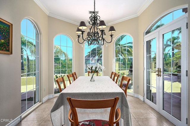 1690 Calle Tierra Vis, Camarillo, CA 93010 - dining space with french doors, light tile patterned floors, crown molding, a chandelier, and baseboards