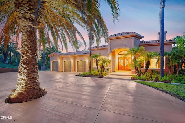 1690 Calle Tierra Vis, Camarillo, CA 93010 - mediterranean / spanish home featuring stucco siding, driveway, an attached garage, and a tiled roof