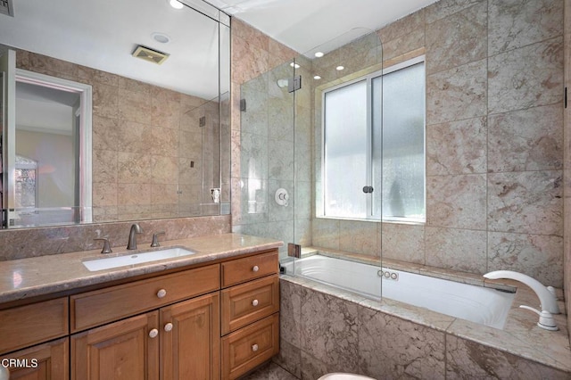 1690 Calle Tierra Vis, Camarillo, CA 93010 - full bath with tile walls, vanity, and tiled shower / bath combo