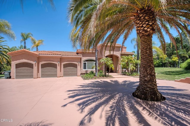 1690 Calle Tierra Vis, Camarillo, CA 93010 - mediterranean / spanish-style house featuring stucco siding, concrete driveway, a garage, and a tile roof