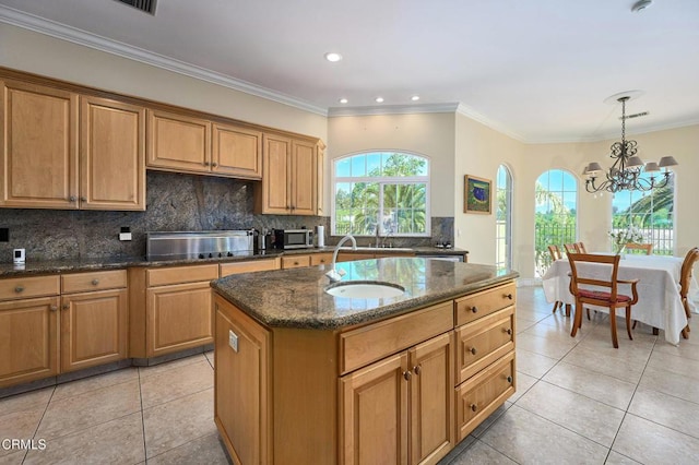 1690 Calle Tierra Vis, Camarillo, CA 93010 - kitchen with cooktop, light tile patterned floors, a chandelier, dark stone countertops, and tasteful backsplash