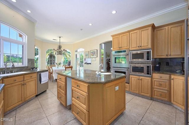 1690 Calle Tierra Vis, Camarillo, CA 93010 - kitchen featuring stainless steel appliances, a sink, backsplash, a center island with sink, and recessed lighting