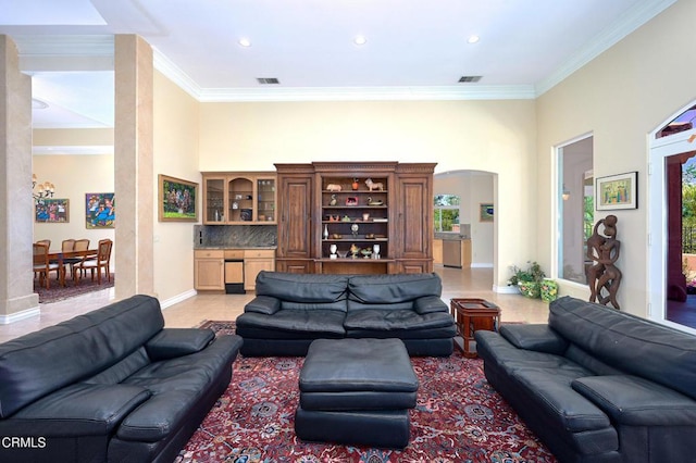 1690 Calle Tierra Vis, Camarillo, CA 93010 - living room featuring arched walkways, crown molding, recessed lighting, baseboards, and a towering ceiling