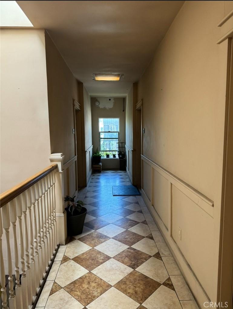 502 S Westlake Ave, Los Angeles, CA 90057 - hall with wainscoting and a decorative wall