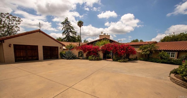 11105 Berry Rd, Valley Center, CA 92082 - view of front facade featuring a chimney, a garage, and a tile roof