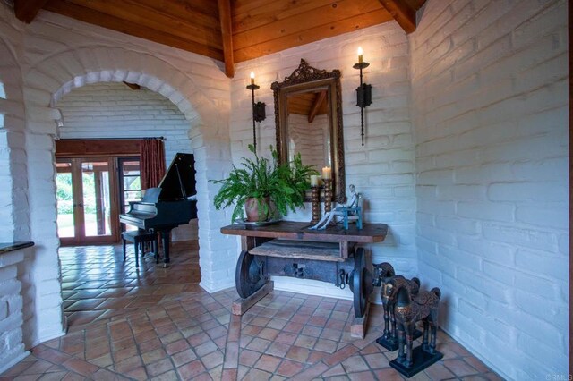 11105 Berry Rd, Valley Center, CA 92082 - hallway with brick wall