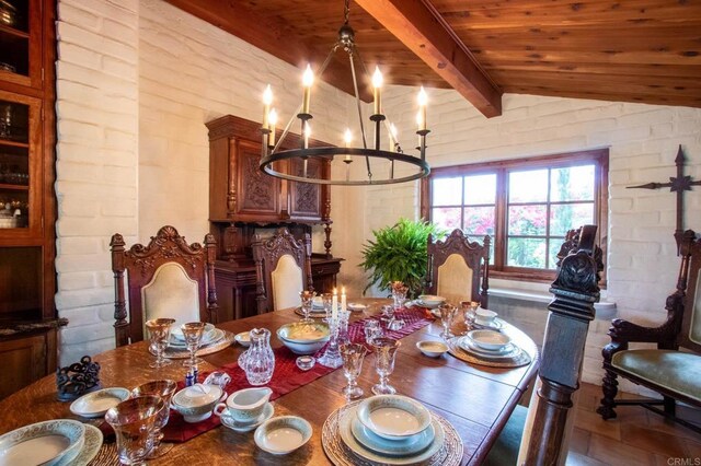 11105 Berry Rd, Valley Center, CA 92082 - dining room featuring a chandelier, wood ceiling, and brick wall