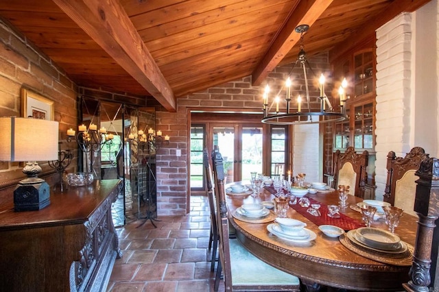 11105 Berry Rd, Valley Center, CA 92082 - dining space with a chandelier, wood ceiling, brick wall, stone finish flooring, and french doors