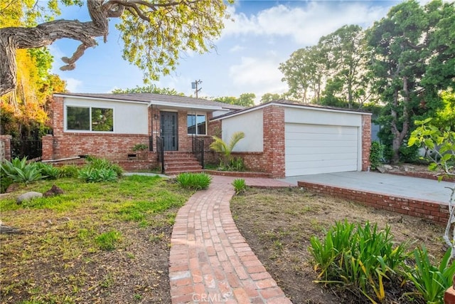 3445 Tilden Ave, Los Angeles, CA 90034 - view of front of property with brick siding, driveway, and stucco siding