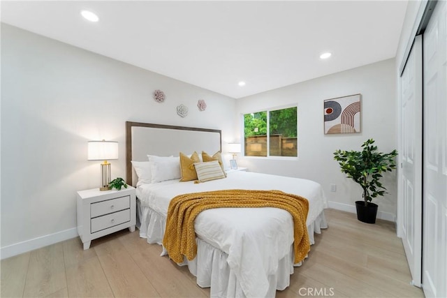 3445 Tilden Ave, Los Angeles, CA 90034 - bedroom with light wood-style flooring, a closet, baseboards, and recessed lighting