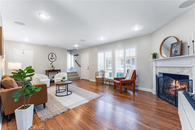 1121 E 1st St, Tustin, CA 92780 - living room featuring stairs, a fireplace, baseboards, wood finished floors, and recessed lighting