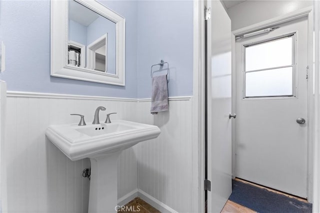 1121 E 1st St, Tustin, CA 92780 - bathroom featuring a wainscoted wall