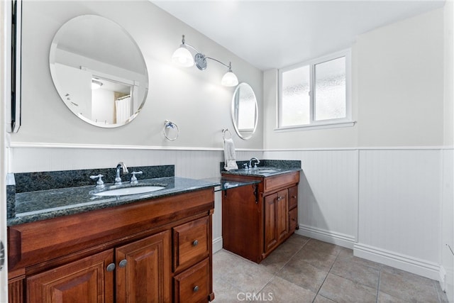 1121 E 1st St, Tustin, CA 92780 - full bathroom with two vanities, a wainscoted wall, and tile patterned floors