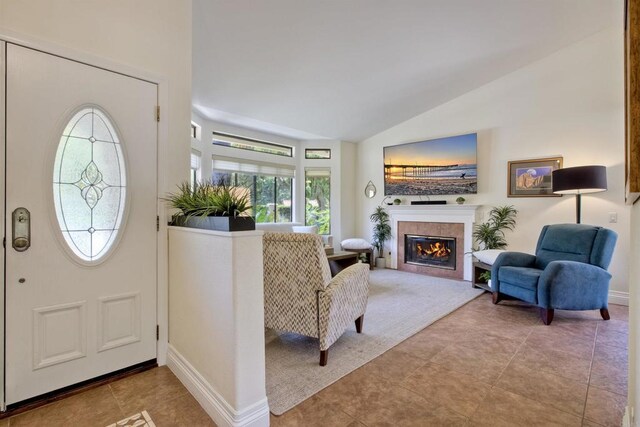 3749 Sarah Ann Dr, Fallbrook, CA 92028 - tiled foyer entrance featuring lofted ceiling, a tiled fireplace, and baseboards