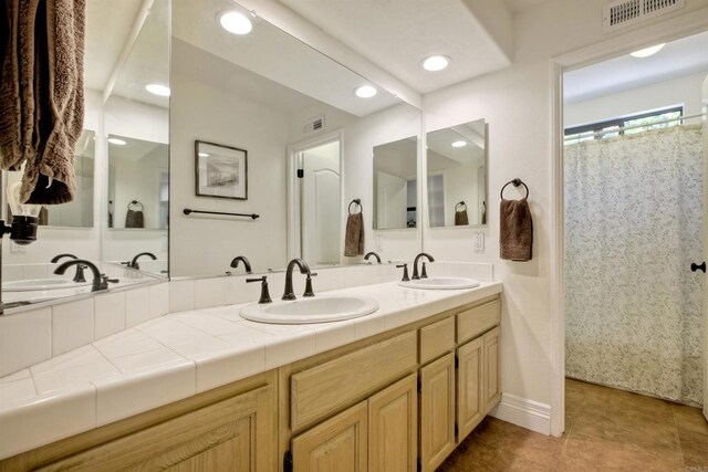 3749 Sarah Ann Dr, Fallbrook, CA 92028 - bathroom featuring double vanity, tile patterned flooring, and recessed lighting