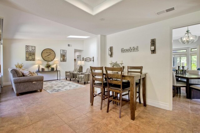 3749 Sarah Ann Dr, Fallbrook, CA 92028 - dining room featuring a chandelier, baseboards, and light tile patterned floors