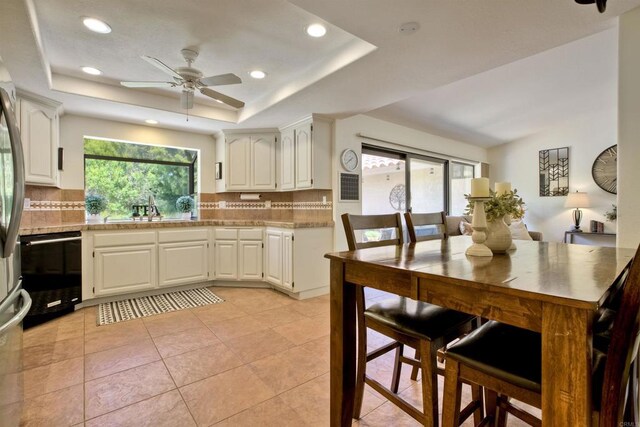 3749 Sarah Ann Dr, Fallbrook, CA 92028 - kitchen featuring a sink, black dishwasher, tasteful backsplash, light countertops, and a ceiling fan