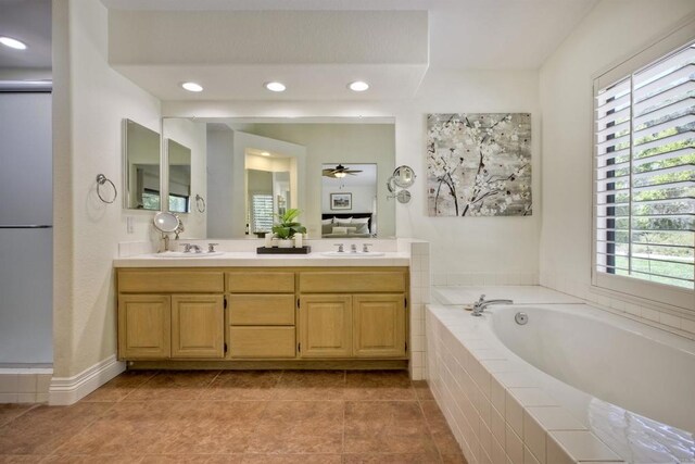 3749 Sarah Ann Dr, Fallbrook, CA 92028 - full bathroom with a garden tub, double vanity, ceiling fan, tile patterned floors, and recessed lighting
