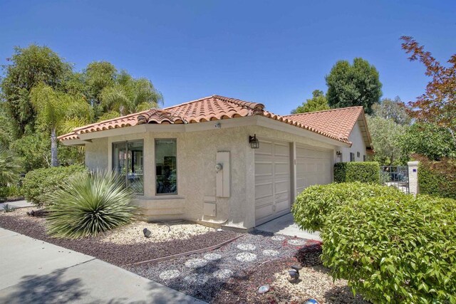 3749 Sarah Ann Dr, Fallbrook, CA 92028 - mediterranean / spanish-style home with a garage, a tiled roof, and stucco siding