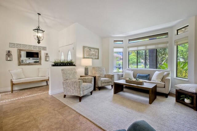 3749 Sarah Ann Dr, Fallbrook, CA 92028 - tiled living room with baseboards and lofted ceiling
