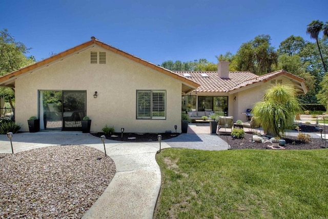 3749 Sarah Ann Dr, Fallbrook, CA 92028 - back of property featuring stucco siding, a tile roof, a patio, and a lawn