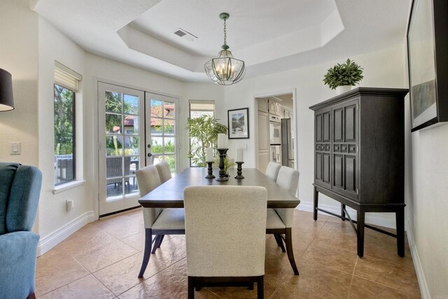 3749 Sarah Ann Dr, Fallbrook, CA 92028 - dining area featuring a chandelier, a raised ceiling, baseboards, and light tile patterned flooring