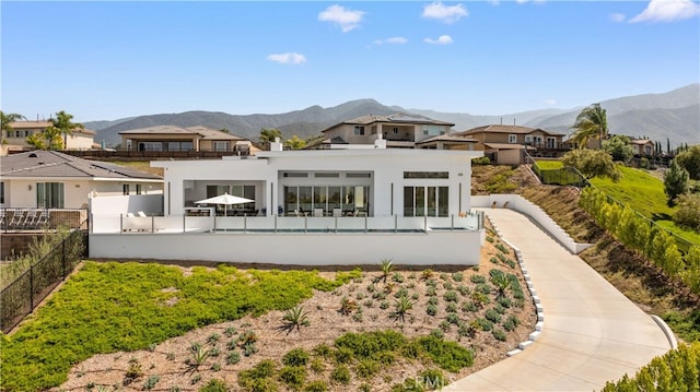 1270 W Chase Dr, Corona, CA 92882 - back of house with a mountain view, a residential view, and stucco siding