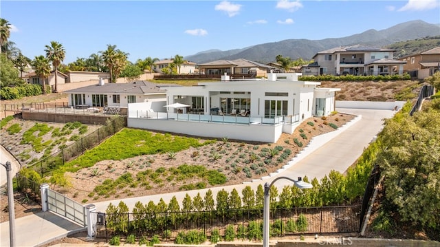 1270 W Chase Dr, Corona, CA 92882 - back of house featuring a residential view, a mountain view, and stucco siding