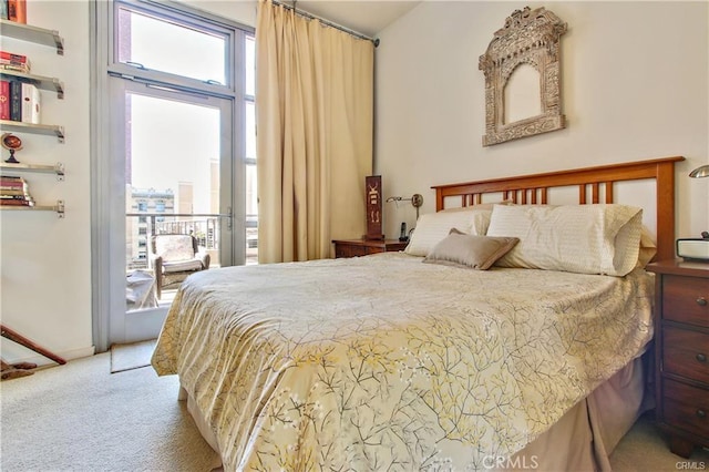 133 The Promenade N Unit 408, Long Beach, CA 90802 - bedroom featuring multiple windows, light colored carpet, and access to outside