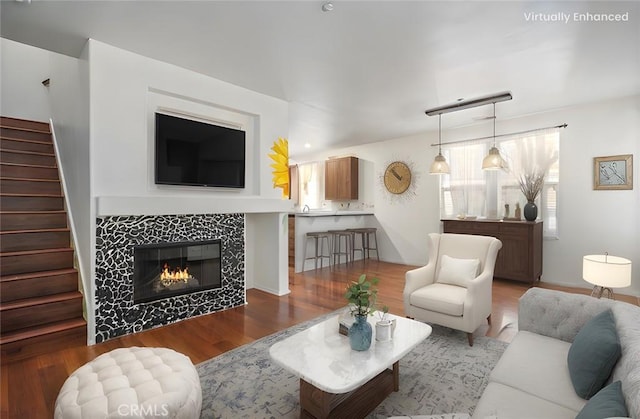 30505 Canyon Hills Rd Unit 1205, Lake Elsinore, CA 92532 - living area with stairs, wood finished floors, and a fireplace