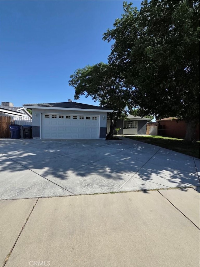 355 Woodlark St, Lancaster, CA 93535 - ranch-style house with a garage, fence, and stucco siding