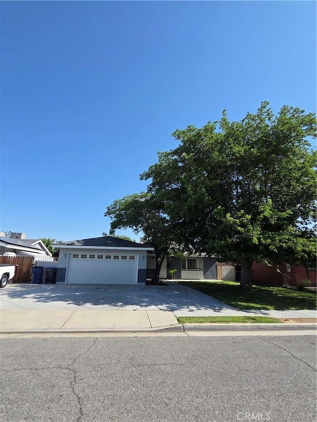 355 Woodlark St, Lancaster, CA 93535 - view of front of home featuring concrete driveway and fence
