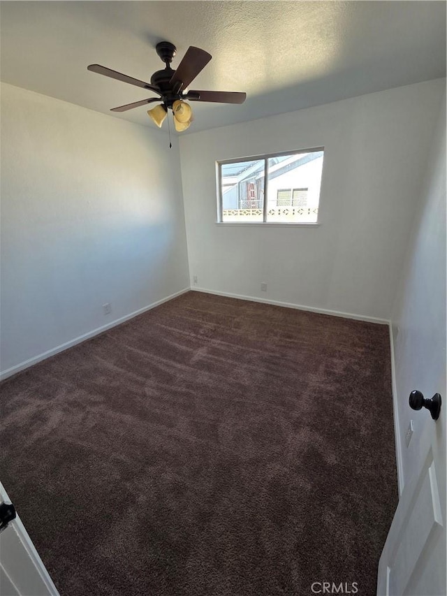 355 Woodlark St, Lancaster, CA 93535 - empty room featuring dark colored carpet, ceiling fan, and baseboards