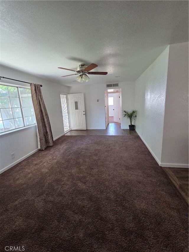 355 Woodlark St, Lancaster, CA 93535 - unfurnished living room featuring carpet floors, plenty of natural light, a textured ceiling, and baseboards