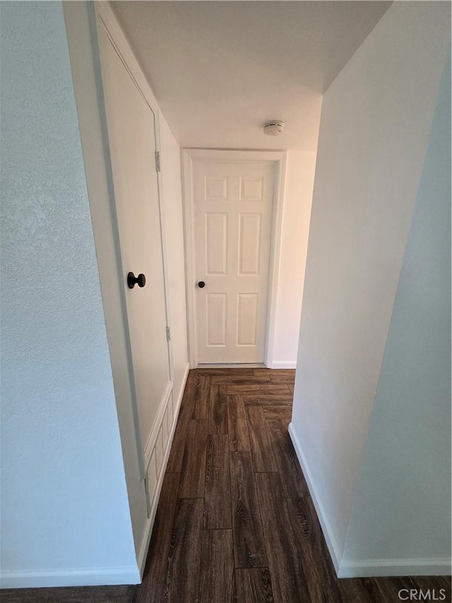 355 Woodlark St, Lancaster, CA 93535 - hallway featuring dark wood finished floors and baseboards