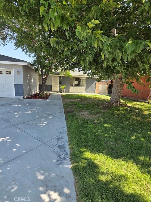 355 Woodlark St, Lancaster, CA 93535 - view of front facade featuring concrete driveway and an attached garage
