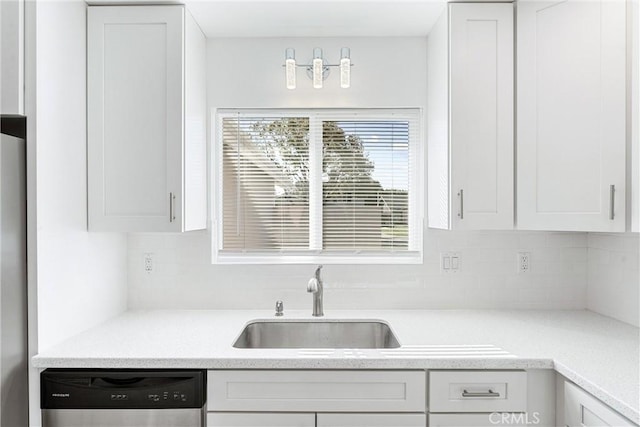 13421 Epping Way, Tustin, CA 92780 - kitchen with dishwasher, a sink, tasteful backsplash, and white cabinetry